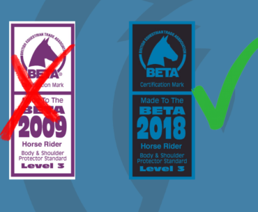 2009 and 2018 BETA certification labels for horse rider body protectors. The out of date label is 2009 and is purple. The in date label is 2018 and is blue.